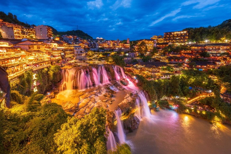 Waterfalls of Furong ancient town in China during the night time