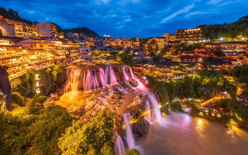 Waterfalls of Furong ancient town in China during the night time