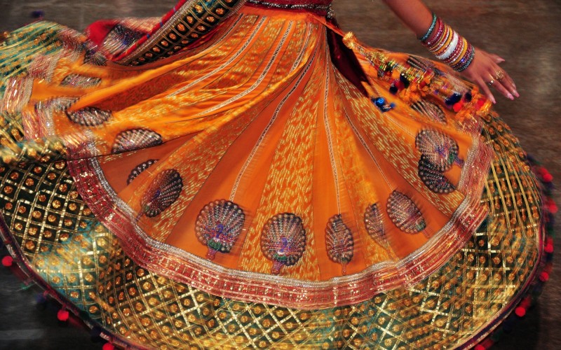 Dancing girl colourful costume during navratri festival celebration