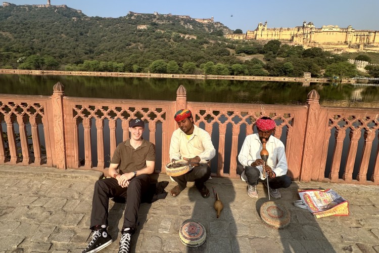 Sitting with snake charmers outside Amber Fort, Jaipur