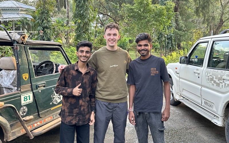 Cameron with guides in Satpura with forest behind