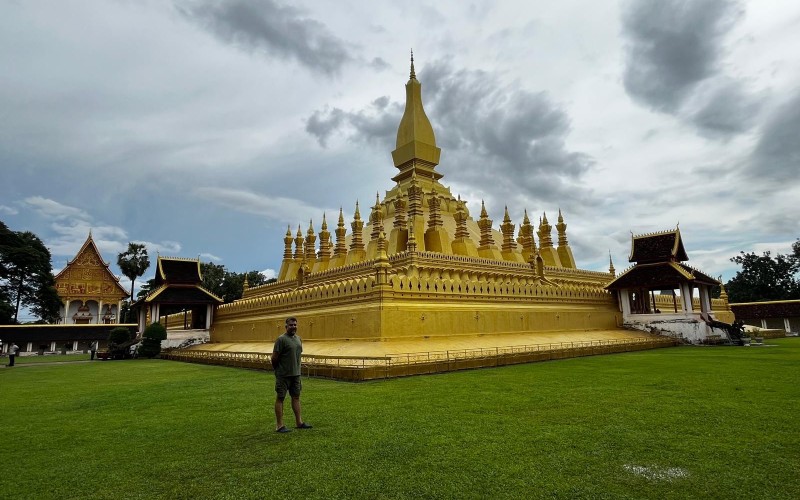Roop Kumar in front of Pha That Luang in Vientiane